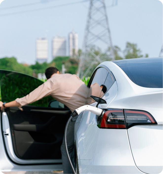 young man recharge ev car battery charging station